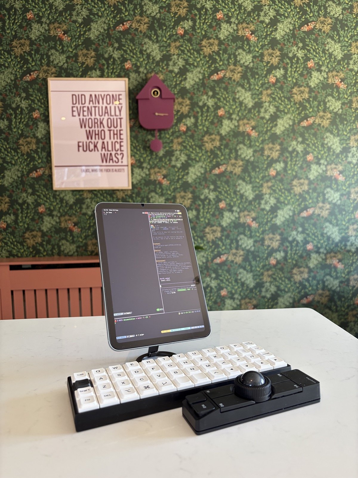 iPad Pro and iPhone running Blink, attached to the same tmux session as the desk